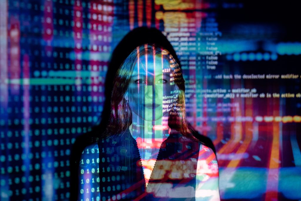 Professional IT services image showing A woman stands before a digital display with dynamic code projections, evoking a modern and innovative IT environment. for managed IT services, cybersecurity, network infrastructure, cloud solutions, and business IT support. - BKY Technologies Professional IT services image showing A woman stands before a digital display with dynamic code projections, evoking a modern and innovative IT environment. for managed IT services, cybersecurity, network infrastructure, cloud solutions, and business IT support.